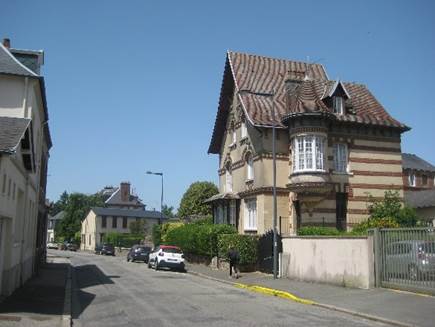 A house on the street
Description automatically generated